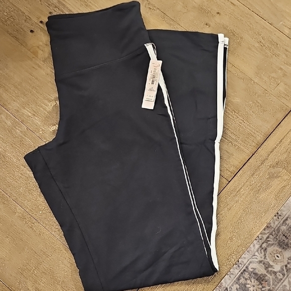 Victoria's Secret Pants - Black Leggings with White Stripe from Victoria's Secret